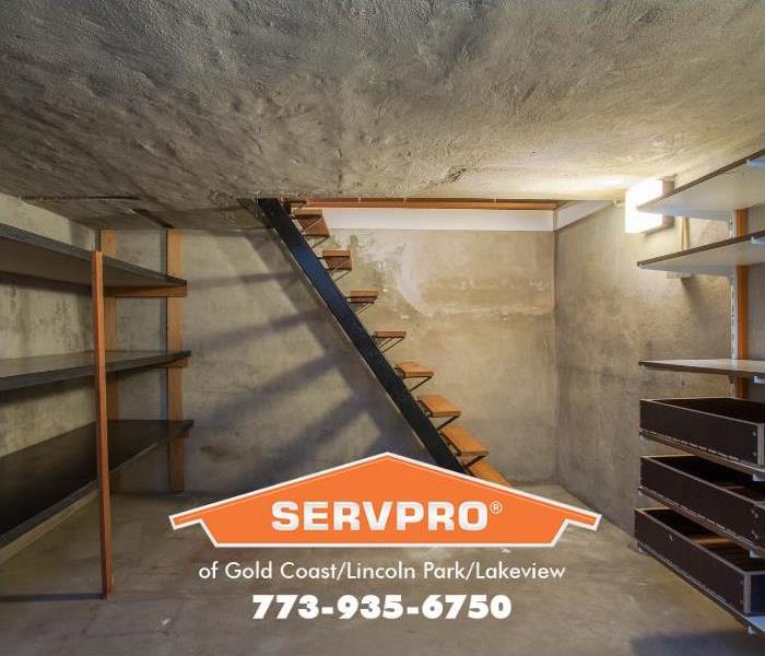 A clean, dry, basement is shown. 